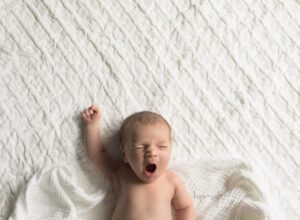 waterdown ontario lifestyle newborn photographer - in home baby session for 1 week old boy yawning